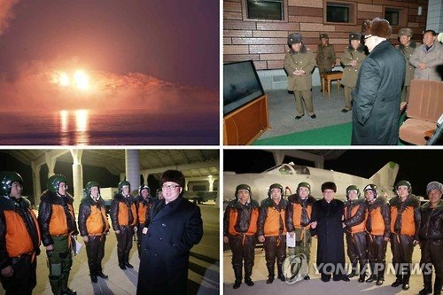 Kim Jong Un huấn luyện chiến đấu giữa đêm - 2 Báo Rodong Shimun của Triều Tiên số ra ngày 21/12 đăng ảnh lãnh đạo Kim Jong Un quan sát tập trận và chụp ảnh lưu niệm với các phi công. Ảnh: Yonhap