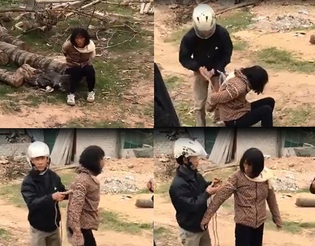 Người phụ nữ bị cho là bắt cóc trẻ em, người dân trói lại nhưng sau đó được cơ quan chức năng giải cứu (ảnh cắt từ clip)