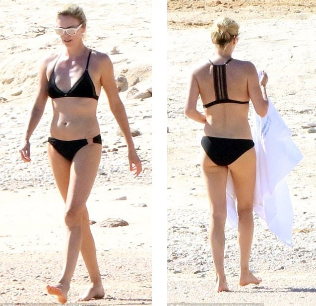 Charlize Theron: 41 tuổi vẫn trẻ đẹp và săn chắc! - 2
Ngôi sao 41 tuổi khoe thân hình săn chắc trong bộ áo tắm hai mảnh.