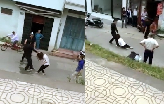 Hà Nội: Cô gái bị người yêu kéo lê, đánh đập vì nghi vào nhà nghỉ với trai lạ - 1 Cô gái bị túm tóc, kéo lê dưới đường. (Ảnh cắt từ clip)