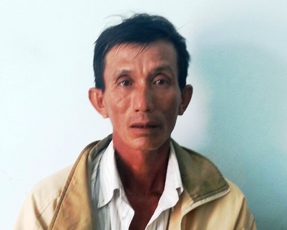 Nghi phạm Long tại cơ quan công an