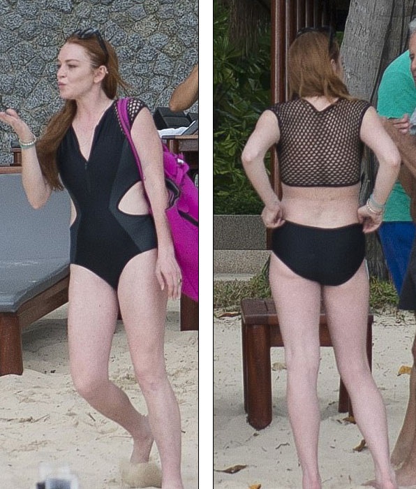 Lindsay Lohan khoe dáng, tắm biển tại Thái Lan - 3
Ngôi sao 30 tuổi trông rất thư thái với mái tóc buông xõa, gương mặt hầu như không trang điểm. Cô hôn gió người hâm mộ trên bãi biển.