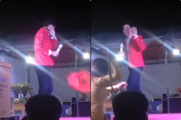 Lưu Chí Vỹ lên tiếng về việc bị bầu show chửi mắng, khán giả đuổi đánh - 1 Hình ảnh Lưu Chí Vỹ bị khán giả hắt nước vào người và cầm gậy đòi đuổi đánh khi đang đứng trên sân khấu. Ảnh: cắt từ clip.