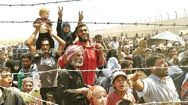 Bản lề cũ và cánh cửa mới - 1 Người tị nạn Syria ở Thổ Nhĩ Kỳ. Ảnh: Sustainability.