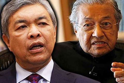 
Phó Thủ tướng Ahmad Zahid Hamidi (trái) và cựu Thủ tướng Mahathir Mohamad (phải) đang thách đố nhau để điều tra xem ai là người tham nhũng
