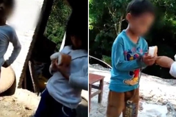 Bé trai 7 tuổi bị xích cả tay lẫn chân như động vật, nhiều người phẫn nộ khi biết sự thật - 2
Thấy cậu bé bị bỏ đói, một cô gái đã đưa bánh mì cho em ăn.