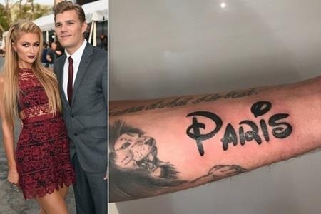 Những hình xăm định tình ấn tượng của các sao - 11 Tháng bảy vừa qua, Chris Zylka đã quyết định xăm tên của cô bạn gái nổi tiếng Paris Hilton lên tay.
