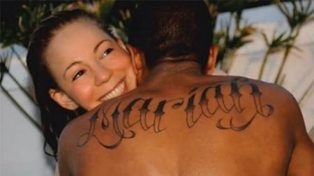 Những hình xăm định tình ấn tượng của các sao - 8 Nick Cannon đã xăm tên của vợ cũ Mariah Carey lên lưng. Và sau khi chia tay, nam ca sĩ đã che đi hình xăm cũ bằng một hình xăm Chúa Jesus.