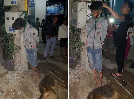 Thanh niên trộm chó bị dân treo cổ lên cột điện - 1 Nam thanh niên trộm chó bị người dân đánh đập, treo cổ lên cột điện.