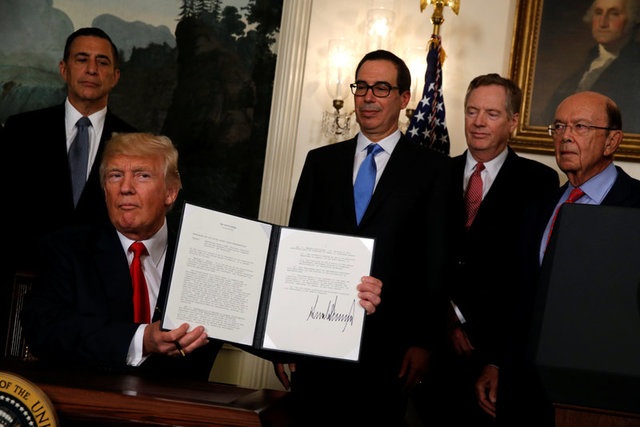 Mỹ điều tra Trung Quốc về hoạt động sở hữu trí tuệ - 1
Tổng thống Mỹ Donald Trump tại lễ ký biên bản ghi nhớ ngày 14/8 (Ảnh: Reuters)
