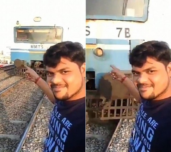 Sốc clip khoảnh khắc người đàn ông bị tai nạn khi quay video “tự sướng” trước đoàn tàu - 1 Shiva mỉm cười chỉ vào đoàn tàu đang chạy đến từ phía sau mình mà không biết tai nạn sắp xảy ra