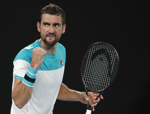 Hạ Cilic sau năm set, Federer lần thứ sáu vô địch Australian Open - 4
Cilic ăn mừng sau khi giành điểm