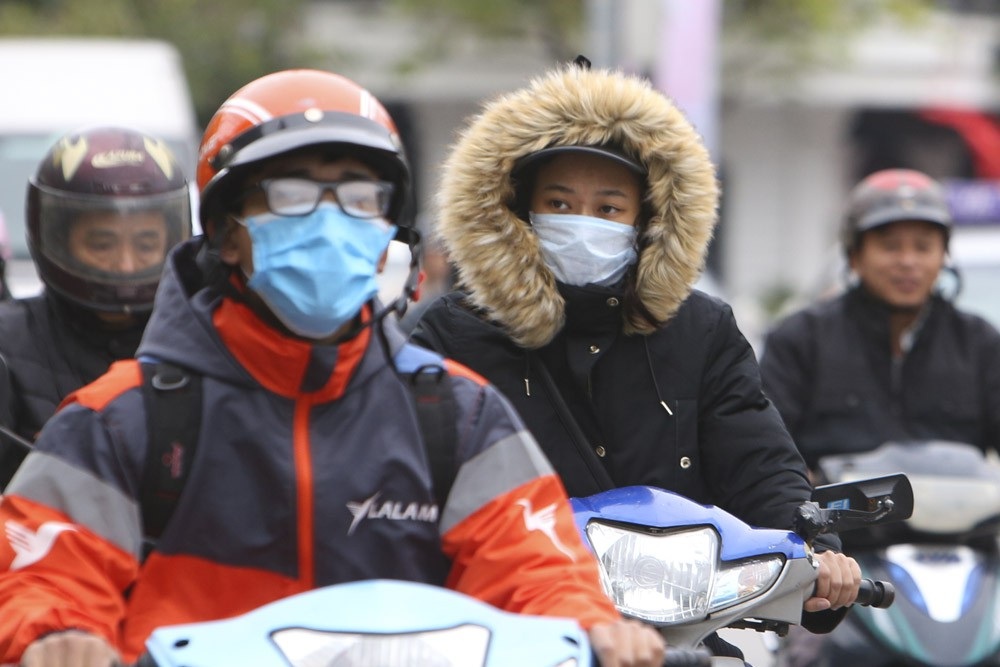 Hà Nội rét đậm, đường phố vắng vẻ trong ngày đầu nghỉ lễ - Ảnh 3. Hà Nội rét đậm, đường phố vắng vẻ trong ngày đầu nghỉ lễ - Ảnh 3.