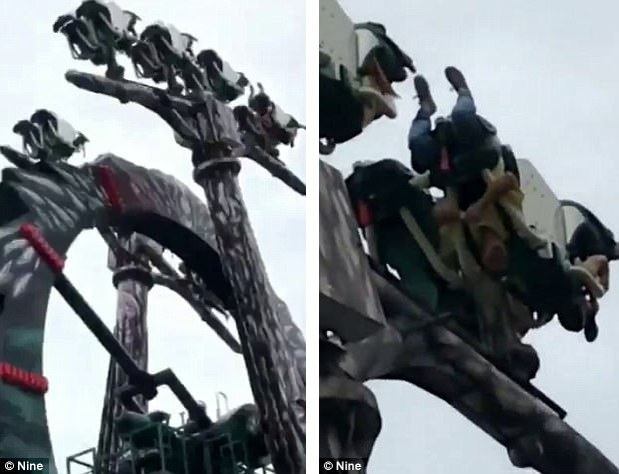 Những du khách hoảng sợ đã bị treo ngược khi vòng quay mắc kẹt và bất ngờ dừng lại.