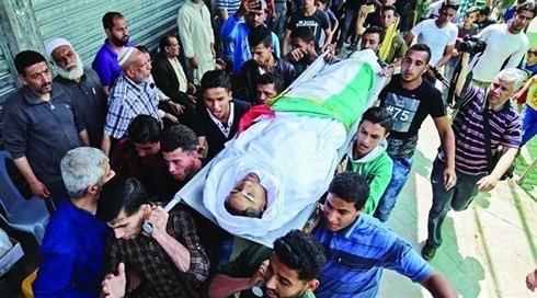 
Một trẻ em Palestine thiệt mạng trong cuộc biểu tình ở Gaza. (ảnh: AFP)
