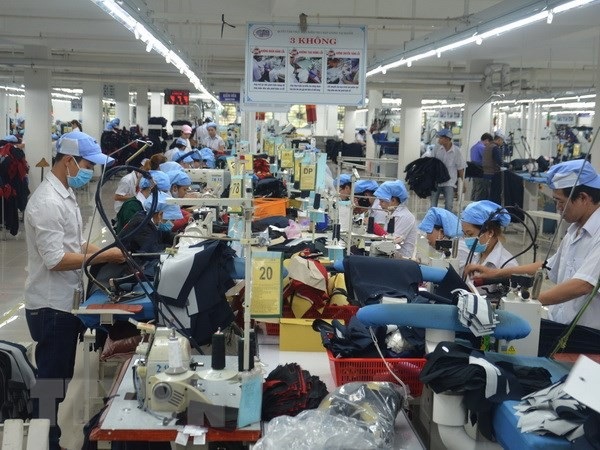 Xây dựng hệ thống bảng lương mới, quy định mức tiền tuyệt đối - 1 (Ảnh minh họa: Đinh Văn Nhiều/TTXVN)
