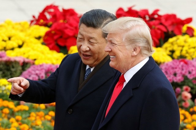 Trung Quốc dọa đáp trả chính sách thương mại của Tổng thống Trump - 1 Chủ tịch Trung Quốc Tập Cận Bình đón Tổng thống Mỹ Donald Trump tại thủ đô Bắc Kinh ngày 9/11 (Ảnh: Reuters)