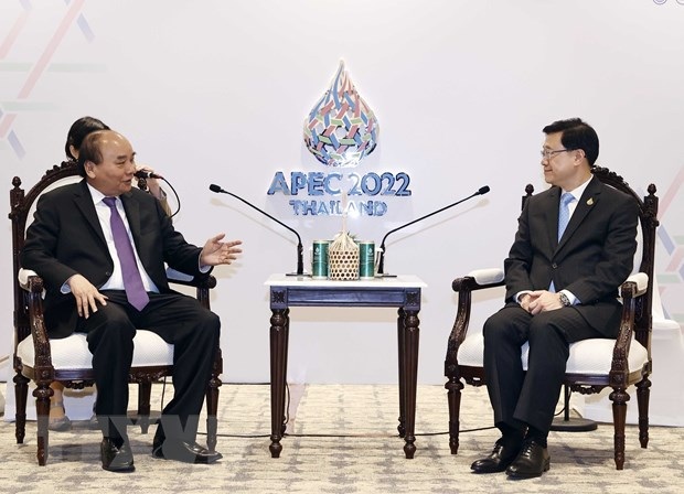 Chủ tịch nước tiếp quan chức Hong Kong và IMF bên lề APEC 2022 - 1