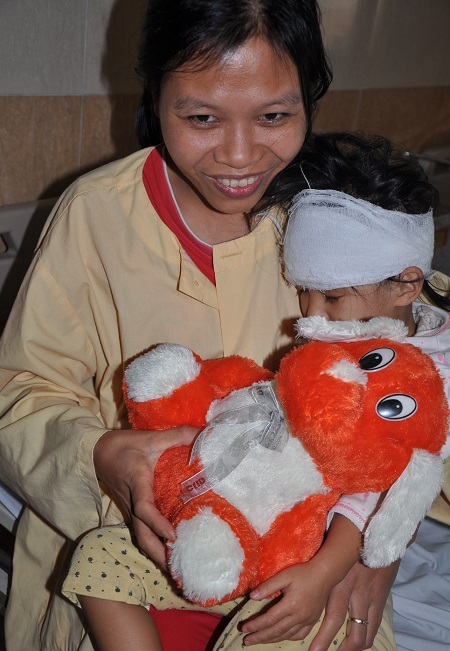 Nụ cười trên gương mặt chị Dương khi nhận tin con sẽ được trở về nhà hôm nay.