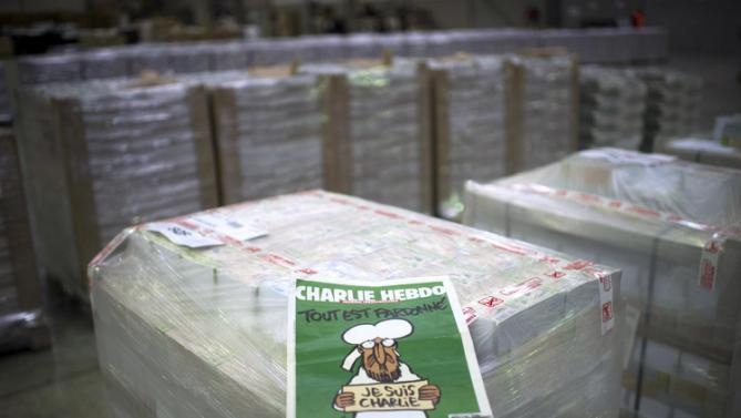 Ấn bản mới của Charlie Hebdo đã chính thức lên sạp - 1 Tạp chí Charlie Hebdo ngày 14/ đã chính thức phát hành ấn bản mới. (Ảnh: