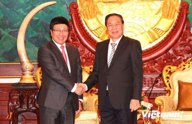 Phó Thủ tướng Phạm Bình Minh thăm chính thức Lào - 1 Chủ tịch Choummaly Sayasone tiếp Phó Thủ tướng Phạm Bình Minh. (Ảnh: Hoàng Chương/Vietnam+)