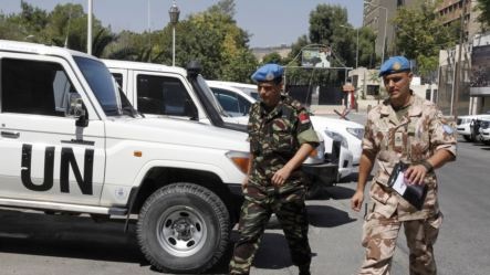 Thành viên phái bộ quan sát viên LHQ trở lại khách sạn ở Damascus ngày 20/8/2012.