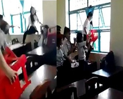 Đang điều tra vụ nữ sinh đánh hội đồng ở Trà Vinh - 1 Nữ sinh trường THCS Lý Tự Trọng đánh hội đồng (ảnh cắt từ clip).