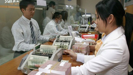 Tỷ giá không lấy dao mổ kiến - 1 Năm 2014 tỷ giá điều chỉnh không quá 1%.