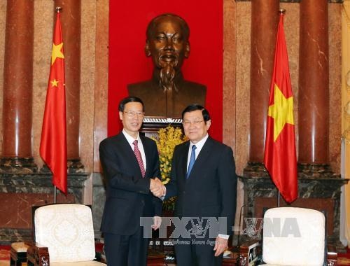 Chủ tịch nước Trương Tấn Sang tiếp đồng chí Trương Cao Lệ (trái). Ảnh: Nguyễn Khang – TTXVN