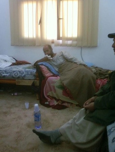 Thăng trầm cuộc đời người con trai sáng giá nhất của ông Gadhafi - 12