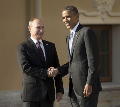 Obama, Putin cố làm dịu căng thẳng bằng những nụ cười - 1 Obama, Putin cố làm dịu căng thẳng bằng những nụ cười