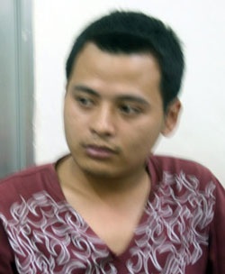 Khởi tố tài xế taxi “chở” cảnh sát trên nắp capô - 1