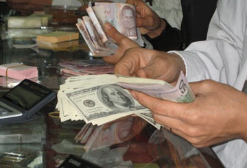 Lại tranh cãi việc nới biên độ tỷ giá VND/USD - 1 Lại tranh cãi việc nới biên độ tỷ giá VND/USD - 1