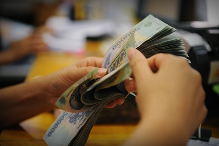 Lãi suất bình quân qua đêm ở mức 7,29%/năm - 1