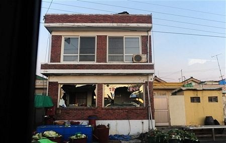 Đảo Hàn Quốc tan hoang sau vụ đấu pháo - 13