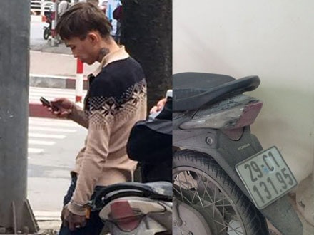 Đối tượng bị bắt giữ cùng chiếc xe máy đeo biển số giả. 