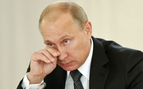 Nga giảm mạnh lương, cắt giảm công chức - 1 Tổng thống Nga Vladimir Putin - Ảnh: Reuters.
