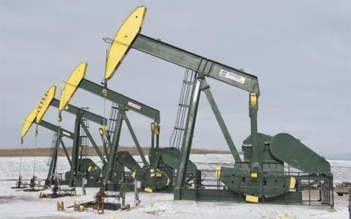 OPEC “thề” giữ sản lượng, giá dầu lại giảm - 1 Một giếng dầu ở Williston, Bắc Dakota vào tháng 12/2014 - Ảnh: Reuters.