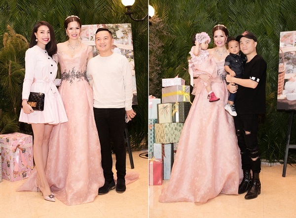 Á hậu Trà Ngọc Hằng trẻ trung với chiếc đầm trắng. Nhà thiết kế Đỗ Mạnh Cường bế con trai nuôi đi tiệc