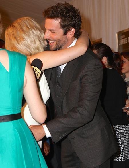 Jennifer "warmly" hugged co-star Bradley Cooper at the ceremony