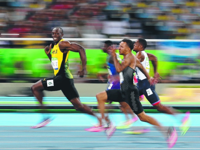 Đằng sau bức ảnh “vừa chạy vừa chơi” của Usain Bolt - 1 Bức ảnh đắt giá về Usain Bolt