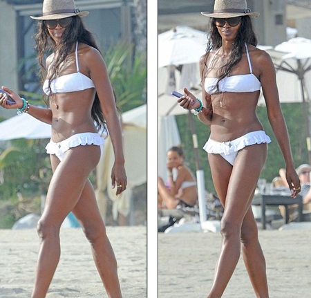 Bị “bồ” đá, Naomi Campbell ra biển giải khuây - 7 Ngoài ra, người đẹp Anh còn lao mình làm công việc để quên đi nỗi buồn chuyện tình cảm.