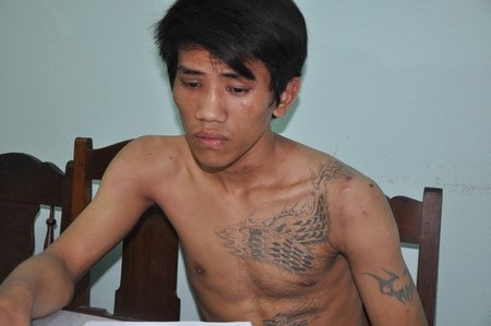 Đối tượng Lê Tấn Dũng tại cơ quan công an. Ảnh: N.P