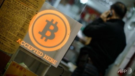 3000 người Hồng Kông sập bẫy tiền ảo bitcoin, mất 386 triệu USD - 1 Mong muốn giàu lên nhanh chóng khiến nhiều người mạo hiểm đầu tư vào bitcoin (Ảnh: AFP)