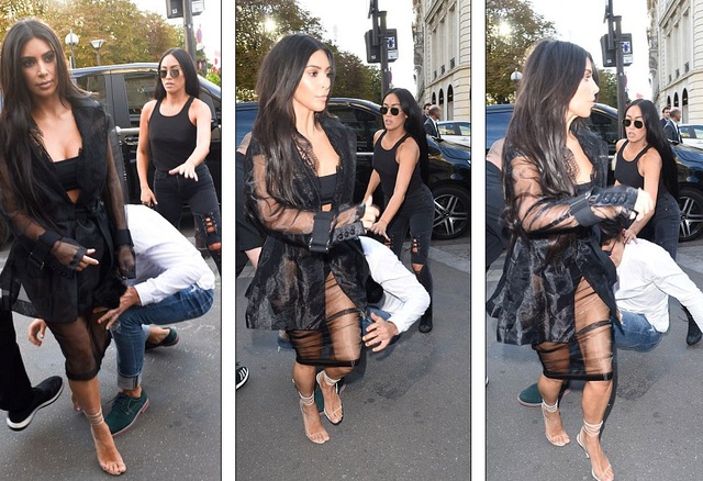Kim Kardashian phát hoảng khi bị fan cuồng đòi sàm sỡ - 11
Hành động bất ngờ của anh ta khiến Kim có chút sốc nhưng vệ sĩ của cô đã kịp thời ra tay.