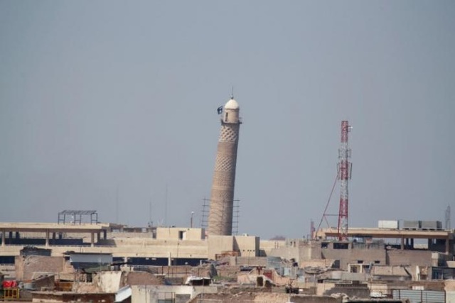 IS cho nổ tung thánh đường Hồi giáo ở Iraq - 5
Lá cờ của IS được nhìn thấy treo ở tháp al-Hadba năm 2014. (Ảnh: Reuters)