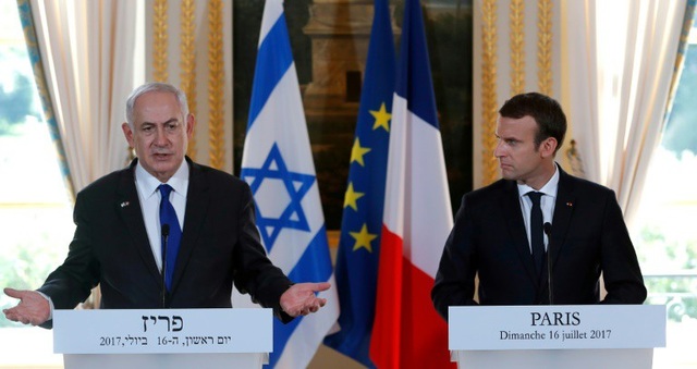 Thủ tướng Israel lần đầu lên tiếng việc Mỹ công nhận Jerusalem - 1
Thủ tướng Israel Benjamin Netanyahu (trái) và Tổng thống Pháp Emmanuel Macron (Ảnh: Reuters)