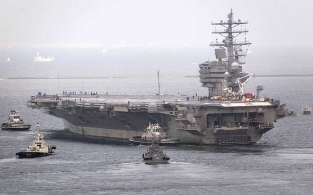 Mỹ điều tàu tấn công, máy bay chiến đấu tới gần Triều Tiên - 2 Tàu sân bay USS Ronald Reagan rời căn cứ hải quân Yokosuka ngày 8/9 (Ảnh: Kyodo)