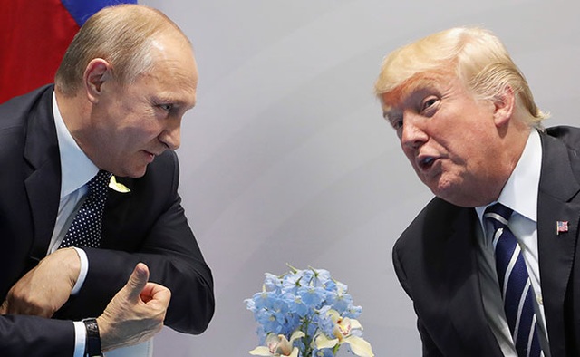 Tổng thống Putin tiết lộ về con người thật của ông Trump - 1 Tổng thống Putin (trái) và Tổng thống Trump tại cuộc hội đàm song phương ở Hamburg ngày 7/7 (Ảnh: AFP)