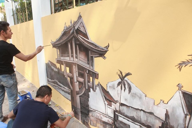 Ngỡ ngàng phố bích họa tái hiện Hà Nội xưa trên phố Phan Đình Phùng - 2 Được biết, đây là dự án được các họa sỹ là cựu học sinh trường THPT Phan Đình Phùng thực hiện nhằm hướng đến kỷ niệm 45 năm thành lập trường.